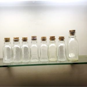 BOGO Eight pretty corked embossed glass jars-- 7 are 4 ounce, 1 is 8 ounce